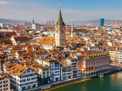 Aerial view of Zurich, Switzerland cityscape with historic clock tower and river, best travel destinations.